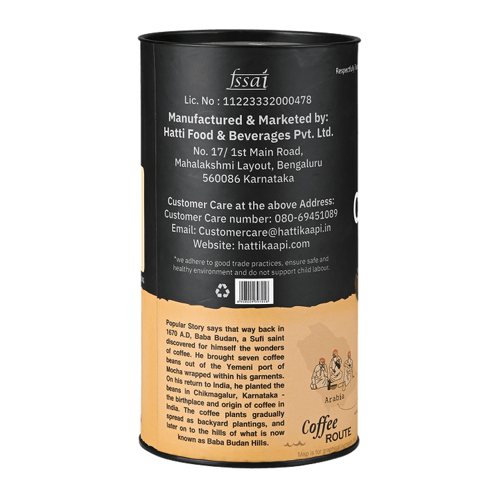 Back view of a cylindrical coffee packaging with text and branding on a black background